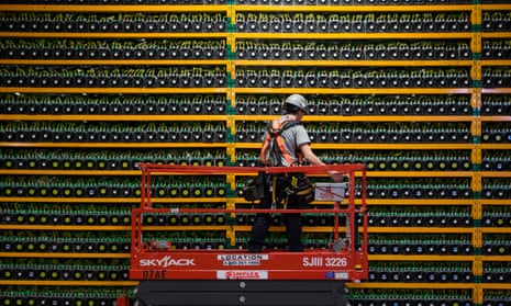 A technician inspects the backside of bitcoin mining at Bitfarms in Saint Hyacinthe, Quebec