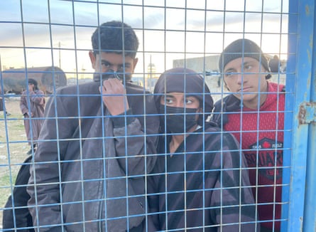 Children at the fence of the camp