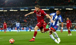 James Milner fends off Porto’s Fernando Andrade during the Champions League quarter-final, first leg at Anfield.
