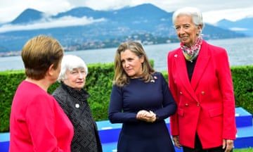 Kristalina Georgieva, Janet Yellen, Chrystia Freeland and Christine Lagarde against a backdrop of a lake and mountain