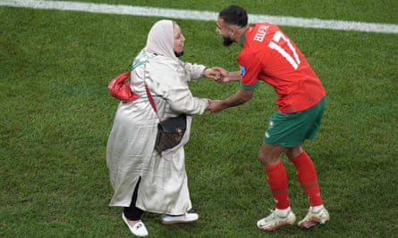 Morocco's Sofiane Boufal celebrates with her mother after her team's historic win over Portugal.