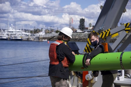 Researchers aboard the Sally Ride recover an autonomous underwater vehicle after a search for discarded barrels near Santa Catalina Island, California.