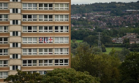 Flags on display in a residential tower block, Stoke-on–Trent.