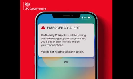 Phone screen with test alert displayed.