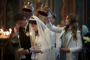A couple get married in Saint Michael’s Cathedral in Kyiv