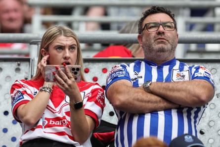 St Helens fans look concerned as they watch their team.