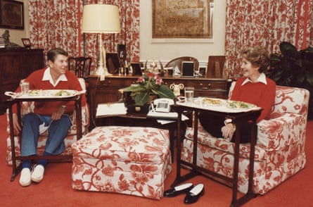Peach florals … President Ronald Reagan and his wife Nancy eat TV dinners in their White House quarters in 1981.