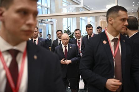 Putin flanked by his security detail