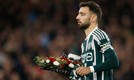 Manchester United's Bruno Fernandes lays down a wreath following the passing of former Manchester United player Bobby Charlton.