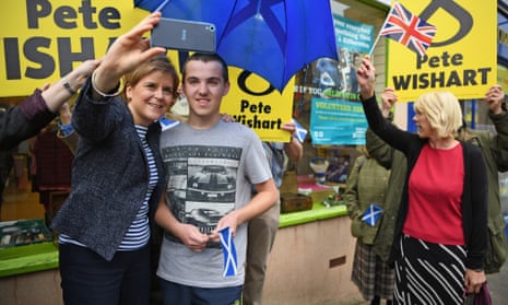Nicola Sturgeon poses for a selfie campaigning in Blairgowrie, Scotland.