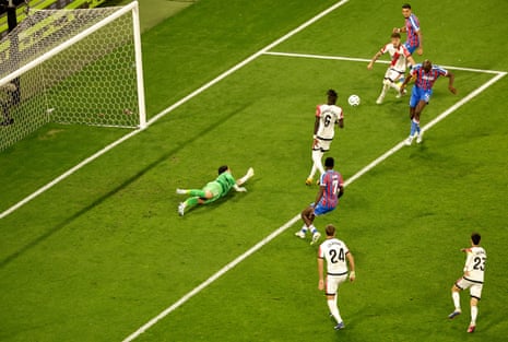 Jean-Philippe Mateta (right) of Crystal Palace scores the opening goal.