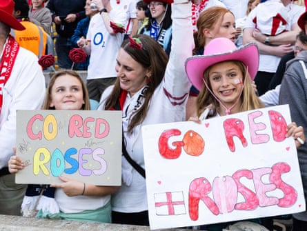 Young fans display banners in the stands at the Women’s Rugby World Cup final.
