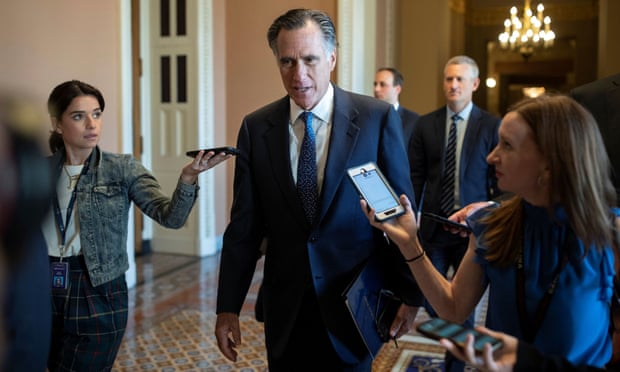Senator Mitt Romney speaks to news reporters before attending a vote on Capitol Hill on 23 June 2021. 