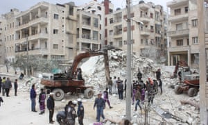 Rescue workers search the rubble after airstrikes in the Kusur district of Idlib, Syria on Wednesday.
