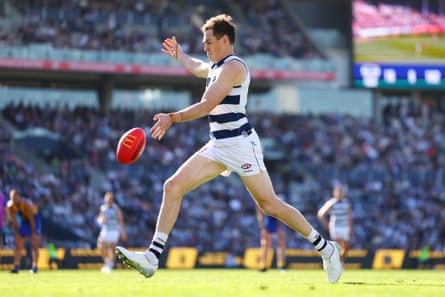 Jeremy Cameron of the Cats kicks for goal during the AFL round 24 match against West Coast