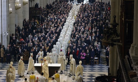 Clergymen file out of the cathedral at the end of the service