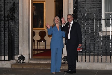 Anthony Albanese and his fiancee, Jodie Haydon, arrive for an informal meeting with Keir Starmer and his wife, Victoria, at Downing Street on Friday night carrying a four-pack of Willie the Boatman beers.