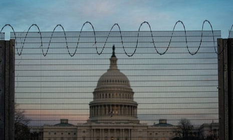 Barbed wire and protective fencing surrounding the US Capitol, Washington, 21 February 2021. 