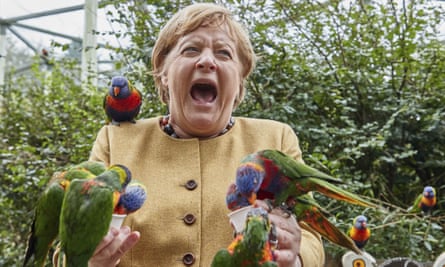 Angela Merkel feeds Australian lorikeets at Marlow Bird Park in Marlow, Germany last week.