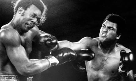 Foreman takes a hit from Muhammad Ali during their famous Rumble in the Jungle heavyweight title bout in October 1974 in Kinshasa.