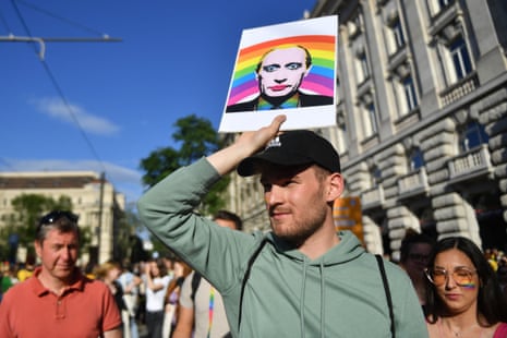 A man holds a placard showing Russia’s president, Vladimir Putin, outside the parliament building during an LGBT rally in Budapest, Hungary.