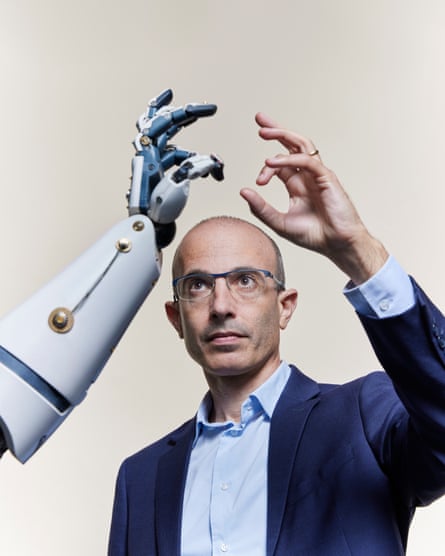 Yuval Noah Harari photographed making the same sign as a robot hand