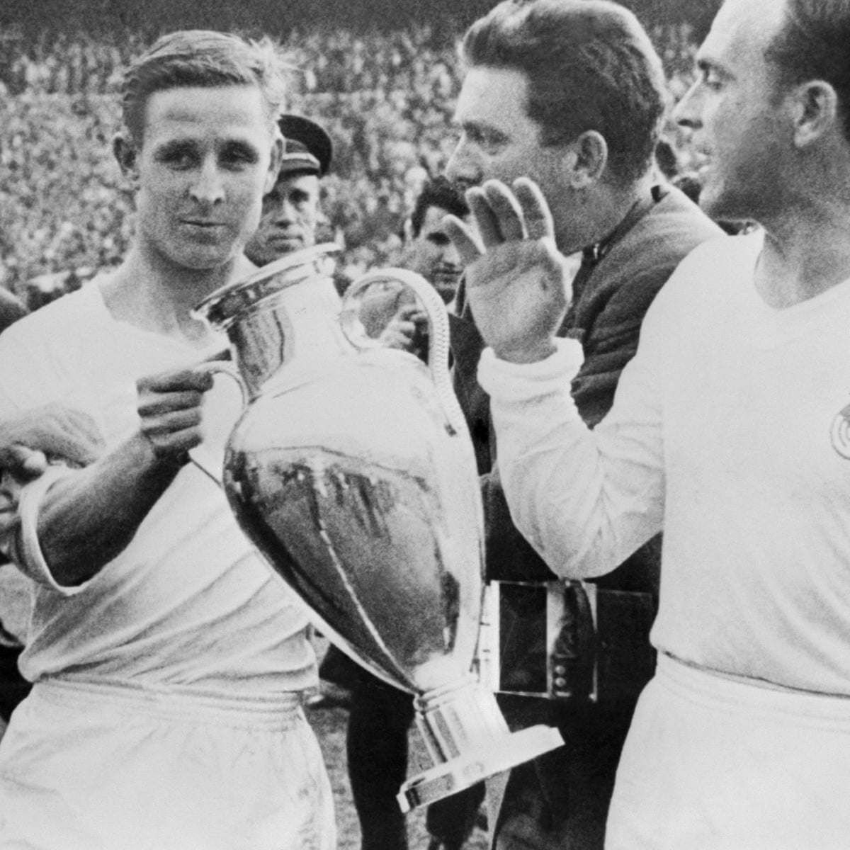 French former soccer player Raymond Kopa waves to the crowd as French former soccer player Raymond Kopa waves to the crowd as