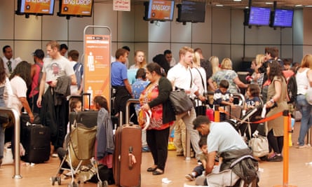 Tourists gather at check-in counters at Sharm el-Sheikh airport.