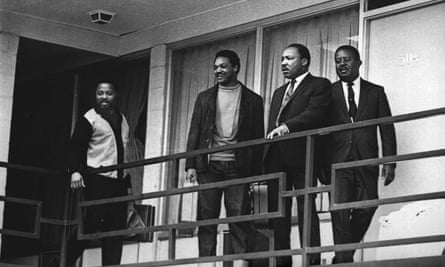 The Rev. Martin Luther King Jr. stands with other civil rights leaders on the balcony of the Lorraine Motel in Memphis, Tenn., on April 3, 1968, a day before he was assassinated at approximately the same place. (AP Photo/Charles Kelly)