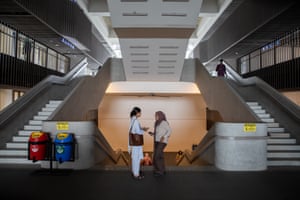 Two people at base of double stairway