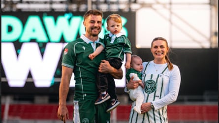 Ollie Devoto poses with his family after a Chicago Hounds game this year.