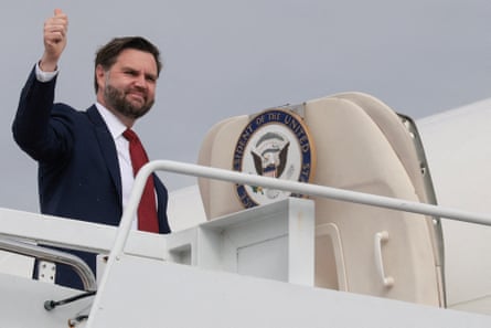 A bearded man boarding a plane makes a thumbs-up.