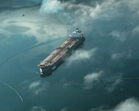 Containment booms surround the oil tanker Exxon Valdez after it ran aground in Prince William Sound, Alaska, March 1989.