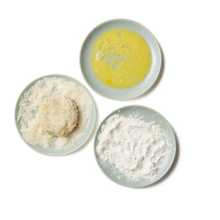 Put the remaining egg into a shallow bowl, and stir in the flour and breadcrumbs to separate plates. Dip each fish cake in the flour, then the beaten egg, and finally the bread crumbs, until completely coated. Refrigerate for at least half an hour (and up to 24 hours) until firm.