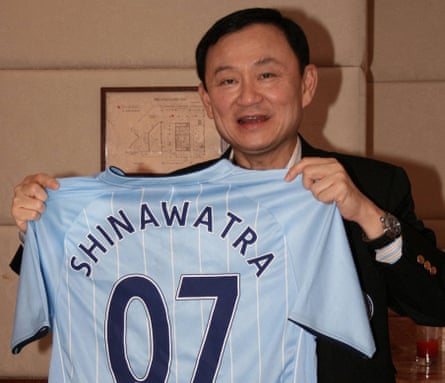 The ousted Thai prime minister, Thaksin Shinawatra, shows a Manchester City jersey during an interview in Hong Kong in 2007.