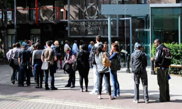 Students queuing outside entrance to London South Bank University.