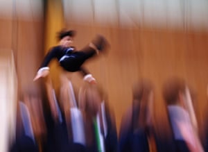 A man is thrown into the air during a routine