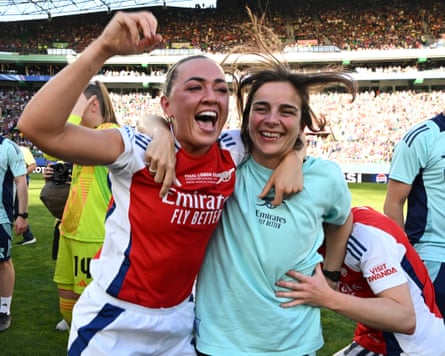 Renee Slegers celebrates with Katie McCabe (right)