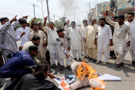 Demonstrators burn an effigy of India's prime minister Narendra Modi during an anti-India protest in Multan on 8 May.