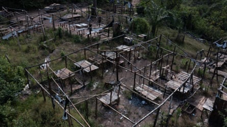 Overhead view of wooden bedframes in skeletons of destroyed buildings