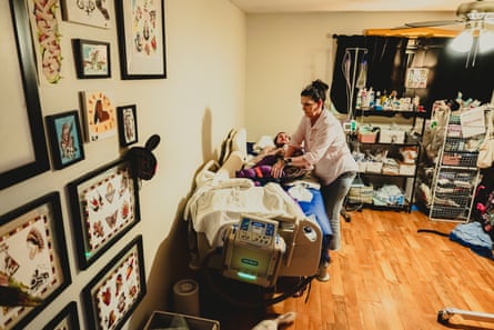 A woman preparing her adult son for bed