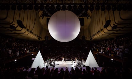 The stage was transformed with two pyramids on each side and a giant sphere hanging from the ceiling