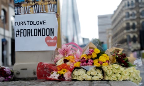 Flowers and messages of defiance are laid near the police corden on Southwark St with the Shard in view near scene of the the London Bridge/ Borough terror attack last night.