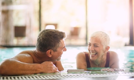 Mature couple having fun at the swimming pool