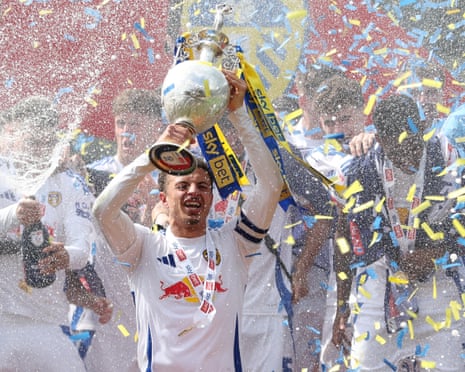 Ethan Ampadu and his Leeds teammates celebrate winning the Championship and returning to the Premier League.