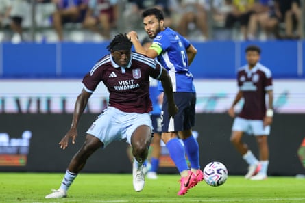 Brian Madjo of Aston Villa controls the ball while under pressure of Kritsada Kaman of BG Pathum United during the pre-season friendly