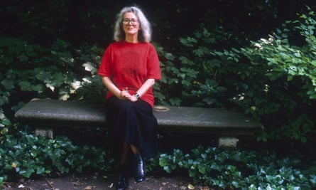 English novelist Angela Carter sitting on a park bench in Paris in 1988.