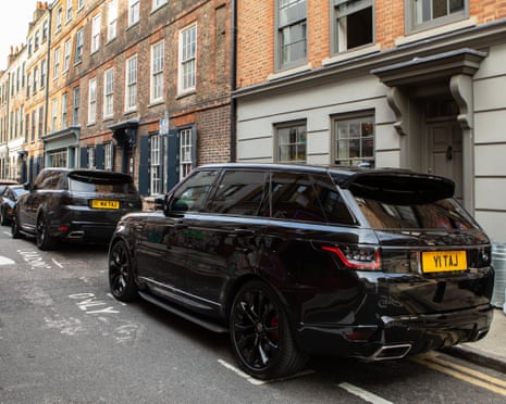 SUVs parked on a terrace street in London