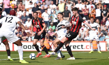 Alexandar Mitrovic of Fulham is fouled by Jack Simpson of Bournemouth for a penalty.