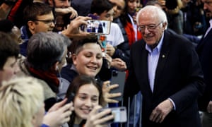Bernie Sanders poses for selfies at at campaign rally in Rindge, New Hampshire